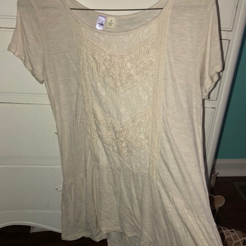 Cream colored blouse.